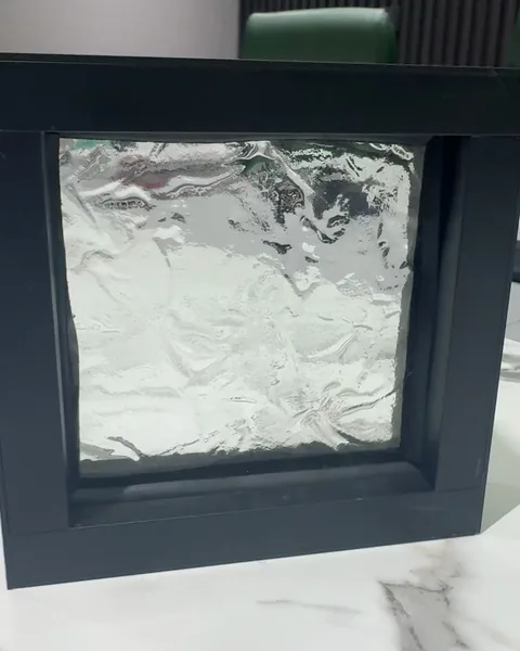 Clear cast, black frame, cast glass by arg