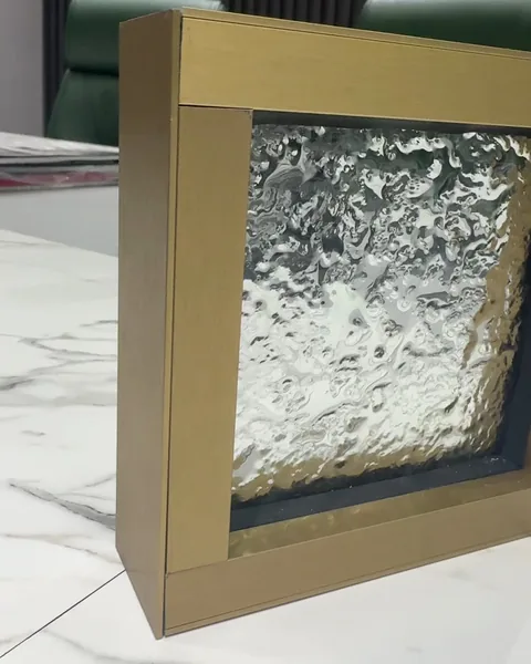 Clear cast, brass frame, cast glass by arg