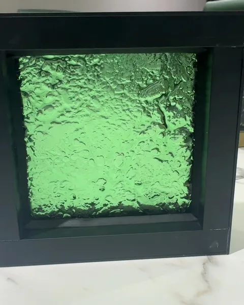 Green cast, black frame, cast glass by arg