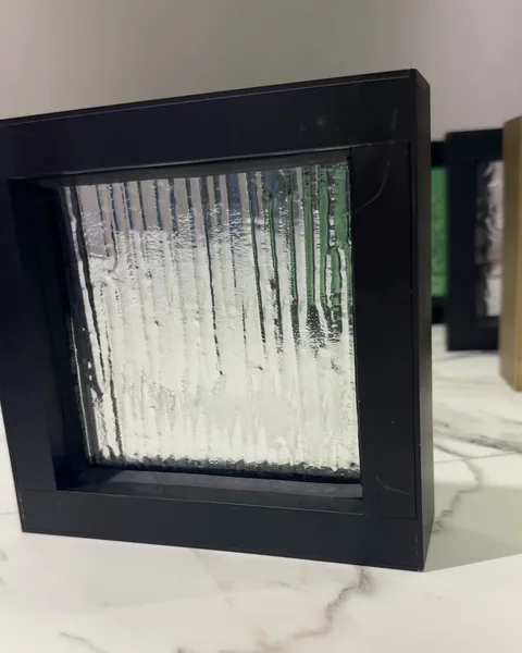 Reeded cast, black frame, cast glass by arg